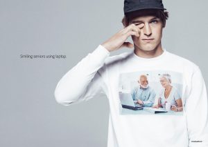 Smiling seniors using a laptop